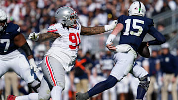 Ohio State Buckeyes defensive tackle Tyleik Williams (91) pursues Penn State Nittany Lions quarterback Drew Allar (15)