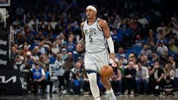 Mar 27, 2025; Orlando, Florida, USA; Orlando Magic forward Paolo Banchero (5) dribbles the ball against the Dallas Mavericks in the third quarter at Kia Center. Mandatory Credit: Jeremy Reper-Imagn Images