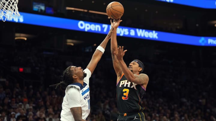 Apr 26, 2024; Phoenix, Arizona, USA; Phoenix Suns guard Bradley Beal (3) shoots over Minnesota Timberwolves center Naz Reid (11) during the second half of game three of the first round for the 2024 NBA playoffs at Footprint Center. Mandatory Credit: Joe Camporeale-USA TODAY Sports