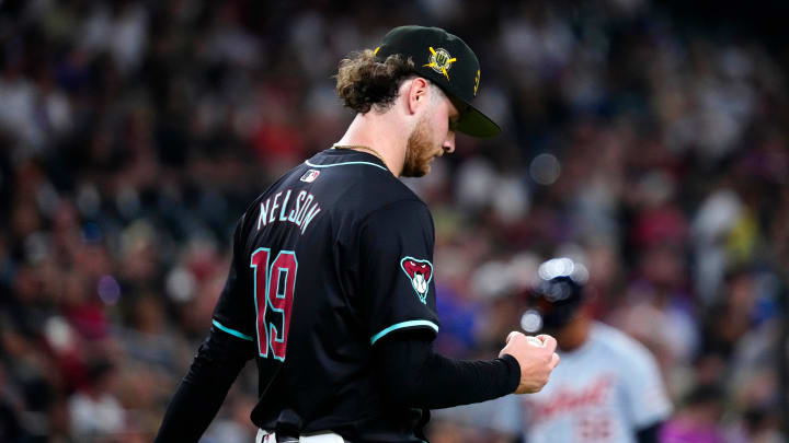 Diamondbacks pitcher Ryne Nelson (19) reacts to allowing a two-run triple against the Tigers during a game at Chase Field on Friday, May 17, 2024.