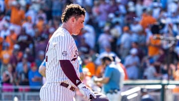 Jun 23, 2024; Omaha, NE, USA; Texas A&M Aggies pinch hitter Ryan Targac (12) walks off the field after a loss to the Tennessee Volunteers at Charles Schwab Field Omaha. Mandatory Credit: Dylan Widger-USA TODAY Sports