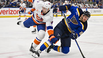 Oct 17, 2024; St. Louis, Missouri, USA;  New York Islanders defenseman Adam Pelech (3) checks St. Louis Blues left wing Pavel Buchnevich (89) during the second period at Enterprise Center. Mandatory Credit: Jeff Curry-Imagn Images