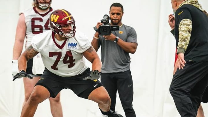 Washington Commanders offensive tackle works out with position coach Bobby Johnson