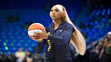 Dallas Wings guard DiJonai Carrington warms up before the game between the Wings and the Seattle Storm.