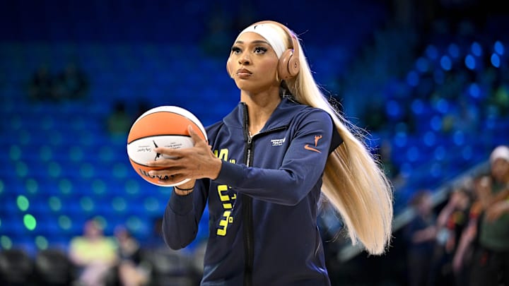 Dallas Wings guard DiJonai Carrington warms up before the game between the Wings and the Seattle Storm.