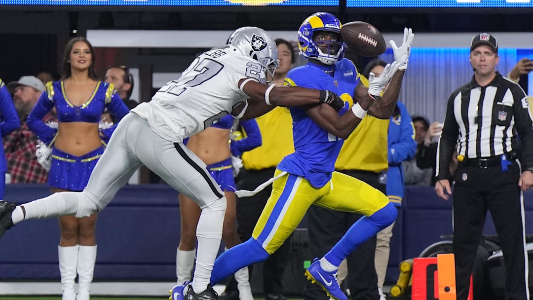 Dec 8, 2022; Inglewood, California, USA; Los Angeles Rams wide receiver Van Jefferson (12) catches a touchdown pass against Las Vegas Raiders cornerback Sam Webb (27) during the second half at SoFi Stadium. Mandatory Credit: Kirby Lee-Imagn Images