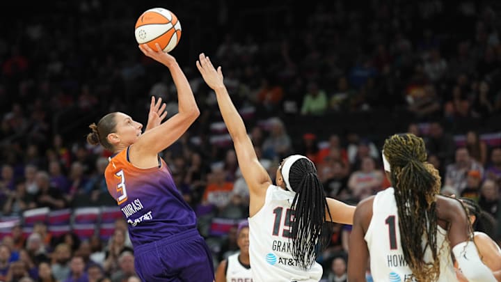 Aug 3, 2023; Phoenix, Arizona, USA; Phoenix Mercury guard Diana Taurasi (3) shoots over Atlanta Dream guard Allisha Gray (15) during the first half at Footprint Center. Mandatory Credit: Joe Camporeale-Imagn Images