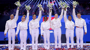 Joscelyn Roberson (second from left) and Leanne Wong (first on right) alongside the 2024 US Women's Artistic Gymnastics Olympic team at Olympic Trials