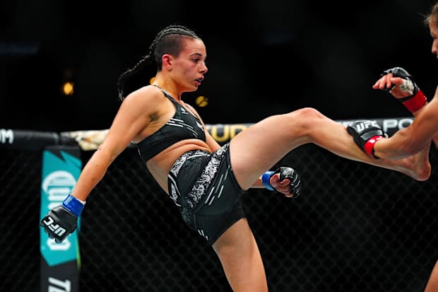 Jasmine Jasudavicius (red gloves) fights Fatima Kline (blue gloves) during UFC Fight Night at Ball Arena. 