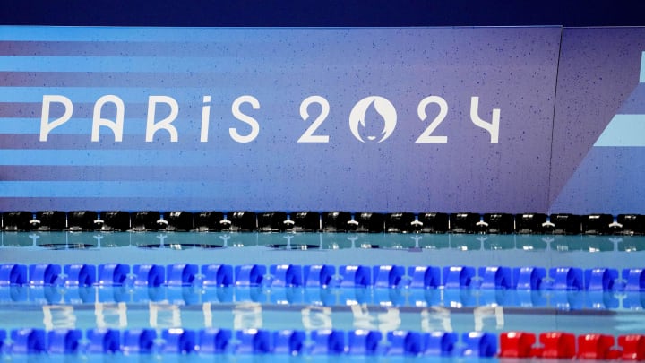 Jul 27, 2024; Nanterre, France; Olympic logos are seen at the pool before the preliminary heats during the Paris 2024 Olympic Summer Games at Paris La Défense Arena. Mandatory Credit: Rob Schumacher-USA TODAY Sports