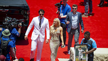  National League pitcher Paul Skenes of the Pittsburgh Pirates walks the red carpet with his girlfriend LSU gymnast Olivia Livvy Dunne.