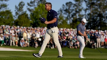 Apr 13, 2025; Augusta, Georgia, USA; Bryson DeChambeau walks off no. 18 during the final round of the Masters Tournament at Augusta National Golf Club. Mandatory Credit: Kyle Terada-Imagn Images