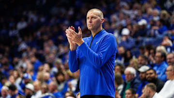Oct 30, 2025; Lexington, KY, USA; Kentucky Wildcats head coach Mark Pope claps as he watches the action during the first half against the Georgetown Hoyas at Rupp Arena at Central Bank Center. Mandatory Credit: Jordan Prather-Imagn Images