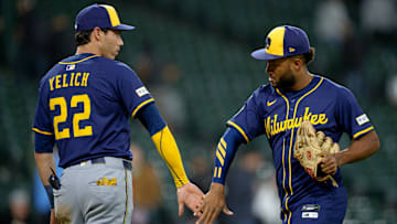 Milwaukee Brewers players Christian Yelich and Jackson Chourio celebrate a victory.