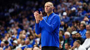 Oct 30, 2025; Lexington, KY, USA; Kentucky Wildcats head coach Mark Pope claps as he watches the action during the first half against the Georgetown Hoyas at Rupp Arena at Central Bank Center. Mandatory Credit: Jordan Prather-Imagn Images