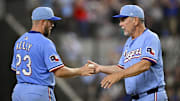 Texas Rangers manager Bruce Bochy (15) takes the ball from starting pitcher Merrill Kelly (23) during the eighth inning against the Cleveland Guardians at Globe Life Field. 
