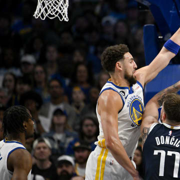 Mar 22, 2023; Dallas, Texas, USA; Golden State Warriors guard Klay Thompson (11) and Dallas Mavericks guard Luka Doncic (77) in action during the game between the Dallas Mavericks and the Golden State Warriors at the American Airlines Center. Mandatory Credit: Jerome Miron-USA TODAY Sports