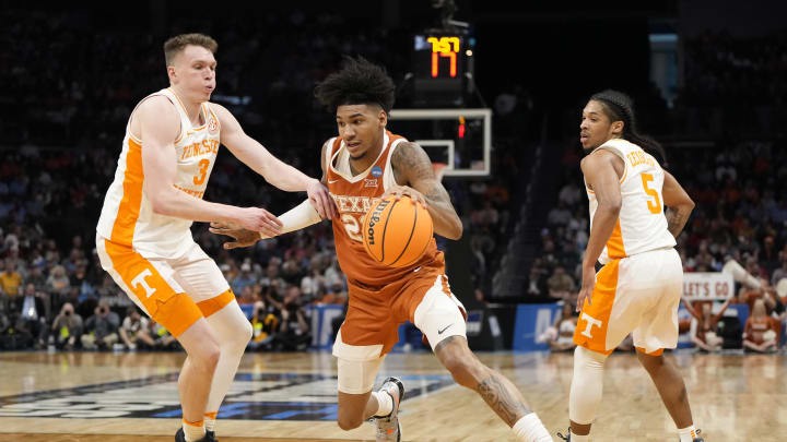 March 23, 2024, Charlotte, NC, USA; Texas Longhorns forward Dillon Mitchell (23) drives against Tennessee Volunteers guard Dalton Knecht (3)  in the second round of the 2024 NCAA Tournament at the Spectrum Center. Mandatory Credit: Bob Donnan-USA TODAY Sports