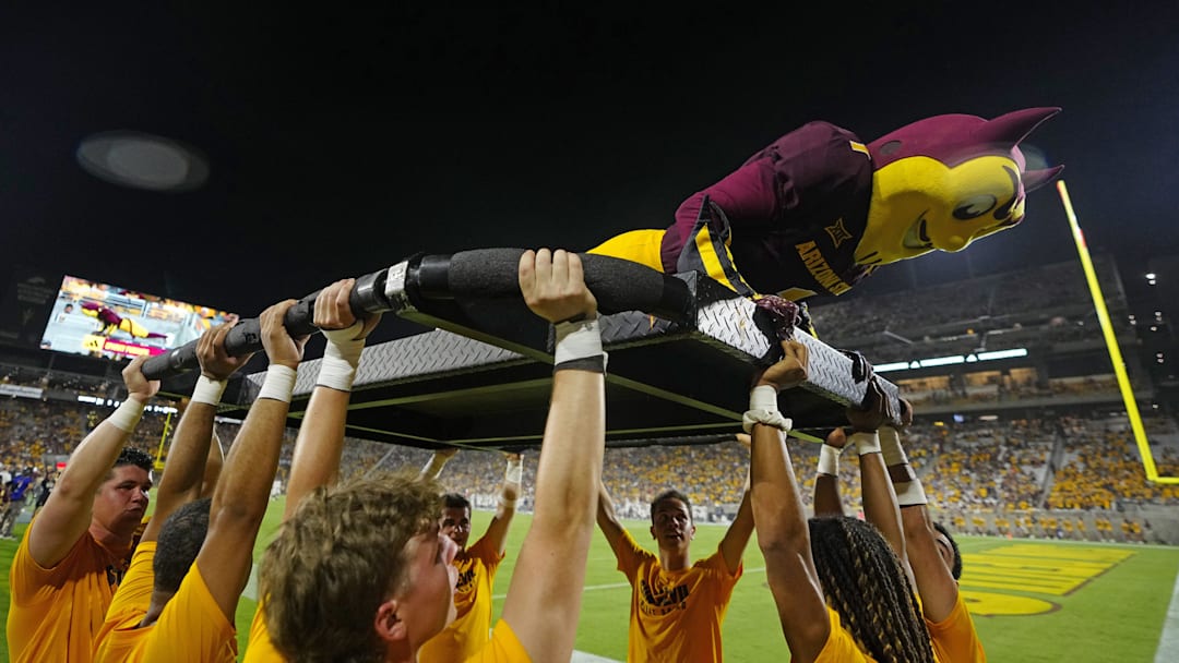 Sparky the Arizona State mascot does pushups after a touchdown against NAU during a game at Mountain America Stadium in Tempe on Aug. 30, 2025.