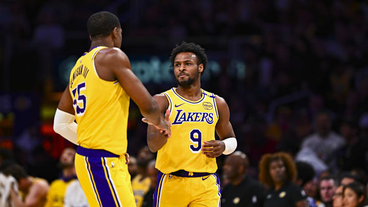 Bronny James celebrates a basket against the Rockets with Trey Jemison
