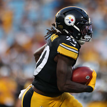  Aug 21, 2025; Charlotte, North Carolina, USA;  Pittsburgh Steelers running back Kaleb Johnson (20) runs the ball during the 1st  quarter against the Carolina Panthers at Bank of America Stadium. Mandatory Credit: Allison Lawhon-Imagn Images