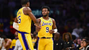 Apr 11, 2025; Los Angeles, California, USA; Los Angeles Lakers guard Bronny James Jr. (9) celebrates with center Trey Jemison III (55) after scoring against the Houston Rockets during the second half at Crypto.com Arena. Mandatory Credit: Jonathan Hui-Imagn Images