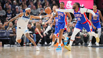 Nov 27, 2024; Minneapolis, Minnesota, USA; Minnesota Timberwolves guard Nickeil Alexander-Walker (9) and Sacramento Kings forward Jae Crowder (99) chase down a loose ball in the fourth quarter at Target Center. Mandatory Credit: Brad Rempel-Imagn Images
