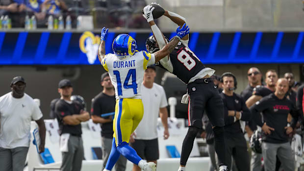 Sep 7, 2025; Inglewood, California, USA; Houston Texans wide receiver Jayden Higgins (81) attempts to complete a pass while L