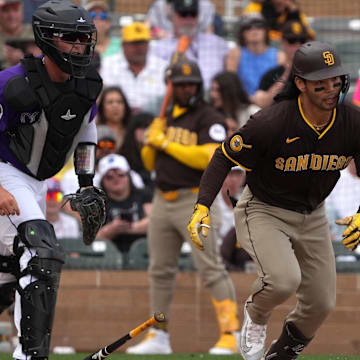 Mar 12, 2025; Salt River Pima-Maricopa, Arizona, USA; San Diego Padres first base Connor Joe (24) hits against the Colorado Rockies in the first inning at Salt River Fields at Talking Stick. Mandatory Credit: Rick Scuteri-Imagn Images