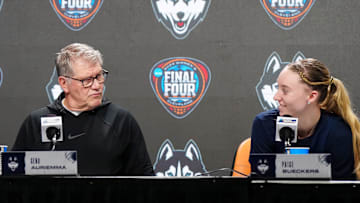 Apr 4, 2024; Cleveland, OH, USA; UConn Huskies coach Geno Auriemma (left) and guard Paige Bueckers during press conference at Rocket Mortgage FieldHouse. Mandatory Credit: Kirby Lee-Imagn Images