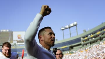 Oct 20, 2024; Green Bay, Wisconsin, USA;  Green Bay Packers head coach Matt LaFleur celebrates while walking off the field following the game against the Houston Texans at Lambeau Field. Mandatory Credit: Jeff Hanisch-Imagn Images