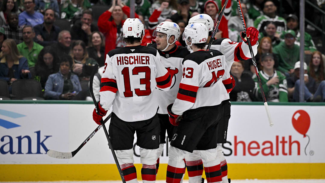 Mar 24, 2026; Dallas, Texas, USA; New Jersey Devils center Nico Hischier (13) and defenseman Luke Hughes (43) and right wing Timo Meier (28) celebrates a goal scored by Meier against the Dallas Stars during the third period at the American Airlines Center. Mandatory Credit: Jerome Miron-Imagn Images