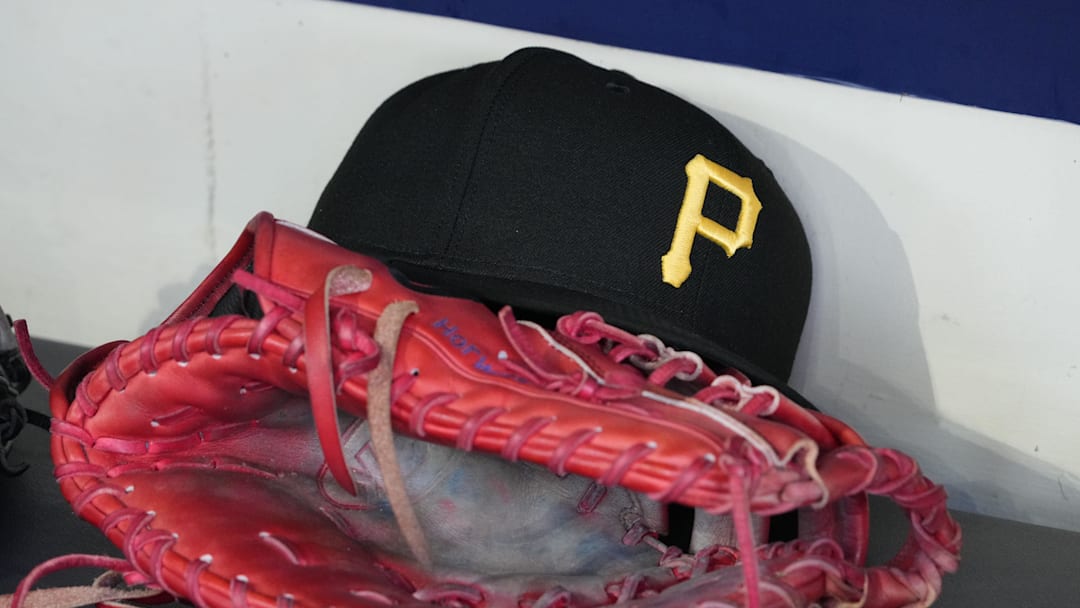 Jun 23, 2025; Milwaukee, Wisconsin, USA; against the Pittsburgh Pirates hat and glove in the dugout before a game against the Milwaukee Brewers at American Family Field. Mandatory Credit: Michael McLoone-Imagn Images Jun 23, 2025; Milwaukee, Wisconsin, USA; against the Pittsburgh Pirates hat and glove in the dugout before a game against the Milwaukee Brewers at American Family Field. Mandatory Credit: Michael McLoone-Imagn Images