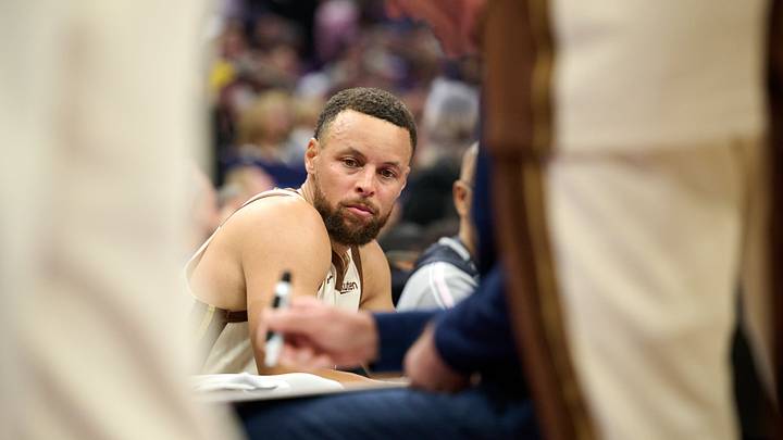 Sacramento, California, USA; Golden State Warriors guard Stephen Curry (30) looks on as head coach Steve Kerr draws up a play against the Sacramento Kings during the first quarter at Golden 1 Center. Mandatory Credit: Robert Edwards-Imagn Images