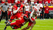 Aug 28, 2025; Kansas City, Missouri, USA; Nebraska Cornhuskers wide receiver Jacory Barney Jr. (2) is tackled by Cincinnati Bearcats defensive back Jiquan Sanks (9) during the first quarter at GEHA Field at Arrowhead Stadium. Mandatory Credit: Dylan Widger-Imagn Images