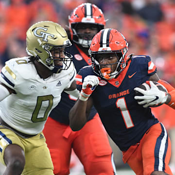 Sep 7, 2024; Syracuse, New York, USA; Syracuse Orange running back LeQuint Allen (1) prepares for contact by Georgia Tech Yellow Jackets linebacker Trenilyas Tatum (0) in the fourth quarter at the JMA Wireless Dome. Mandatory Credit: Mark Konezny-Imagn Images