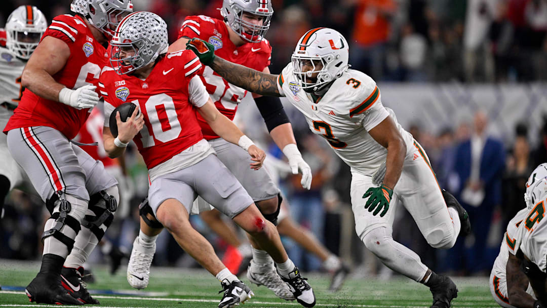 Dec 31, 2025; Arlington, TX, USA; Miami Hurricanes defensive lineman Akheem Mesidor (3) chases Ohio State Buckeyes quarterback Julian Sayin (10) during the 2025 Cotton Bowl and quarterfinal game of the College Football Playoff at AT&T Stadium. Mandatory Credit: Jerome Miron-Imagn Images