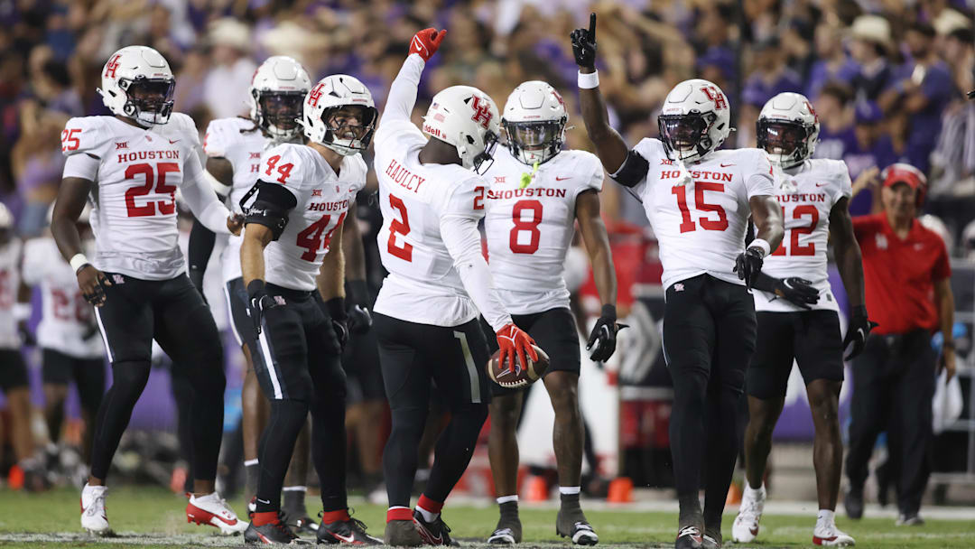 Oct 4, 2024; Fort Worth, Texas, USA; Houston Cougars defensive back A.J. Haulcy (2) celebrates making an interception against the TCU Horned Frogs with his teammates in the second quarter at Amon G. Carter Stadium. Mandatory Credit: Tim Heitman-Imagn Images