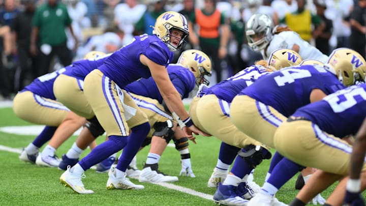 Huskies quarterback Will Rogers (7) prepares to take a first-half snap against Eastern Michigan. 