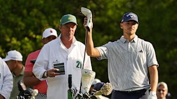 Apr 10, 2025; Augusta, Georgia, USA; Nicolai Hojgaard and his caddy, Gareth Lord, play on the fifth tee during the first round of the Masters Tournament. Mandatory Credit: Kyle Terada-Imagn Images
