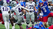 Kansas State Wildcats running back Joe Jackson and Kansas Jayhawks defensive back DJ Graham II 