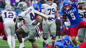 Kansas State Wildcats running back Joe Jackson and Kansas Jayhawks defensive back DJ Graham II 