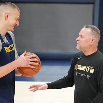 May 31, 2023; Denver, CO, USA; Denver Nuggets center Nikola Jokic (15) talks with head coach Michael Malone during a practice session on media day before the 2023 NBA Finals at Ball Arena. Mandatory Credit: Kyle Terada-Imagn Images