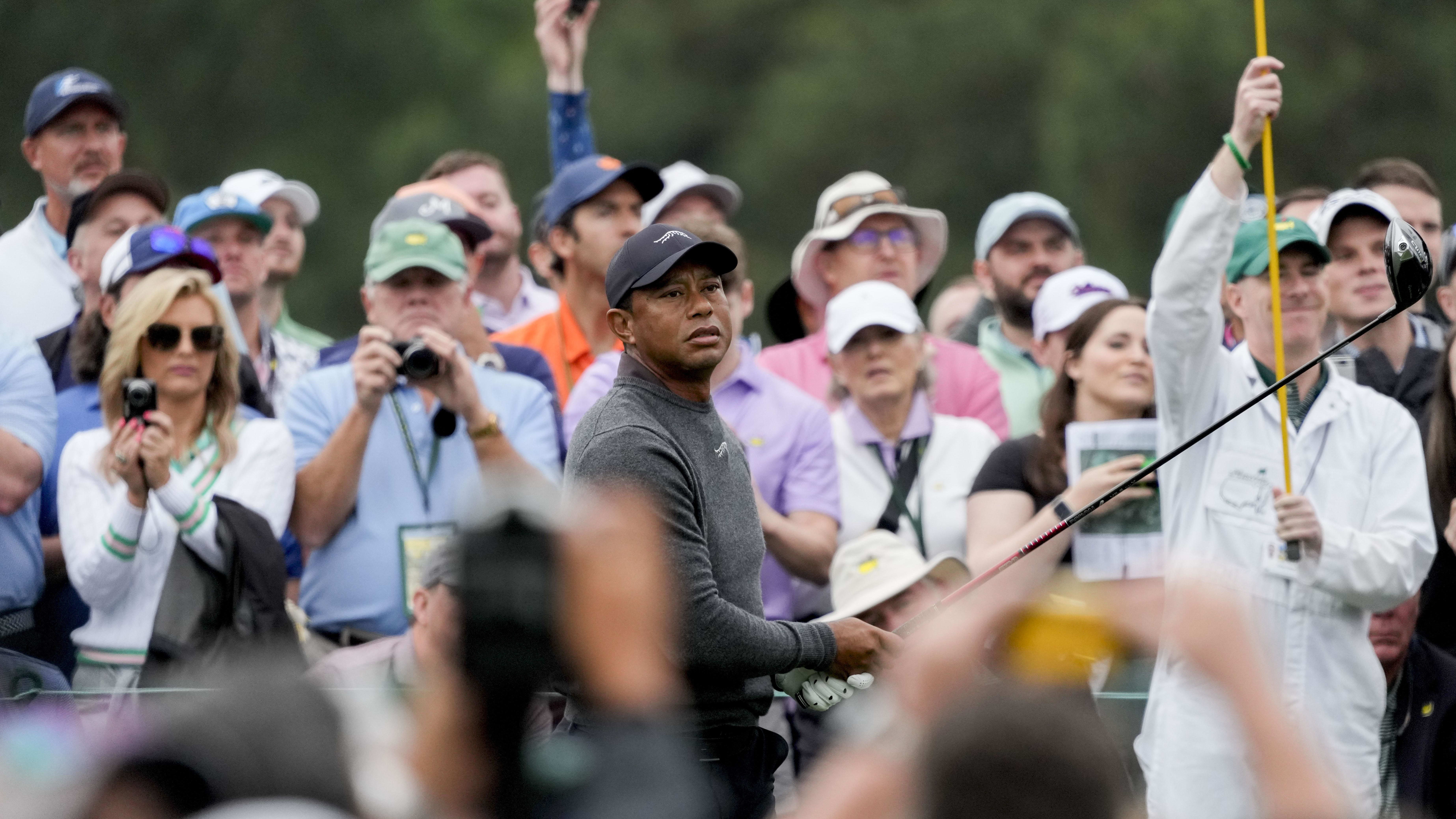 Apr 9, 2024; Augusta, Georgia, USA; Tiger Woods follows his shot from the no. 8 tee during a