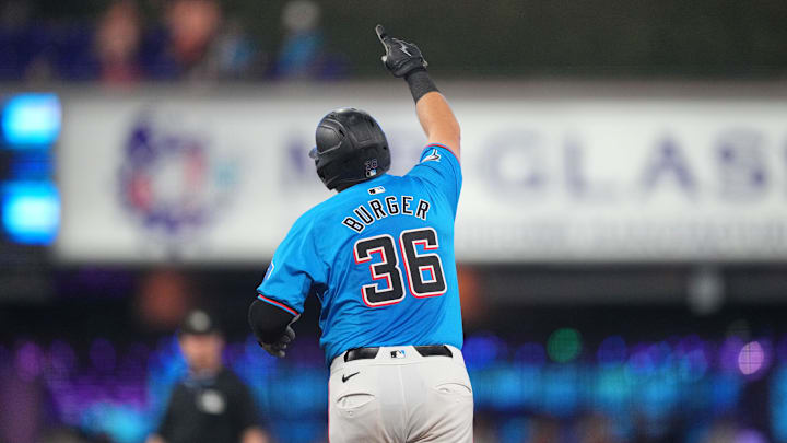 Jake Burger celebrates a home run in his final season with the Marlins.