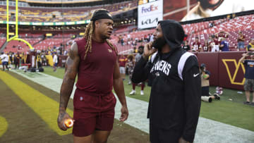 Baltimore Ravens wide receiver Odell Beckham Jr. (R) and Washington Commanders defensive end Chase Young (L)