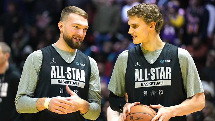 Feb 18, 2023; Salt Lake City, UT, USA; Domantas Sabonis (left) and Lauri Markkanen react during NBA All-Star Game practice at Huntsman Center. Mandatory Credit: Kirby Lee-Imagn Images