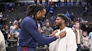 Jan 14, 2025; Dallas, Texas, USA; Denver Nuggets center DeAndre Jordan (left) talks with Colorado Buffaloes quarterback Shedeur Sanders after the game between the Dallas Mavericks and the Nuggets at the American Airlines Center. Mandatory Credit: Jerome Miron-Imagn Images