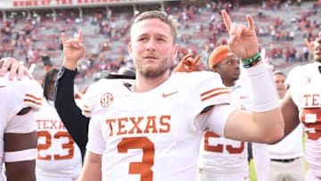 Nov 16, 2024; Fayetteville, Arkansas, USA; Texas Longhorns quarterback Quinn Ewers (3) celebrates after the game against the Arkansas Razorbacks at Donald W. Reynolds Razorback Stadium. Texas won 20-10.