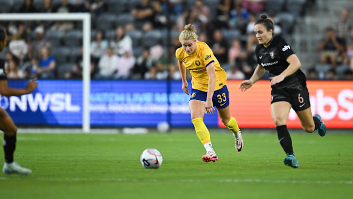 Utah Royals FC forward Hannah Betfort (33) and Angel City FC defender Megan Reid (6) battle for the ball during the second half at BMO Stadium 